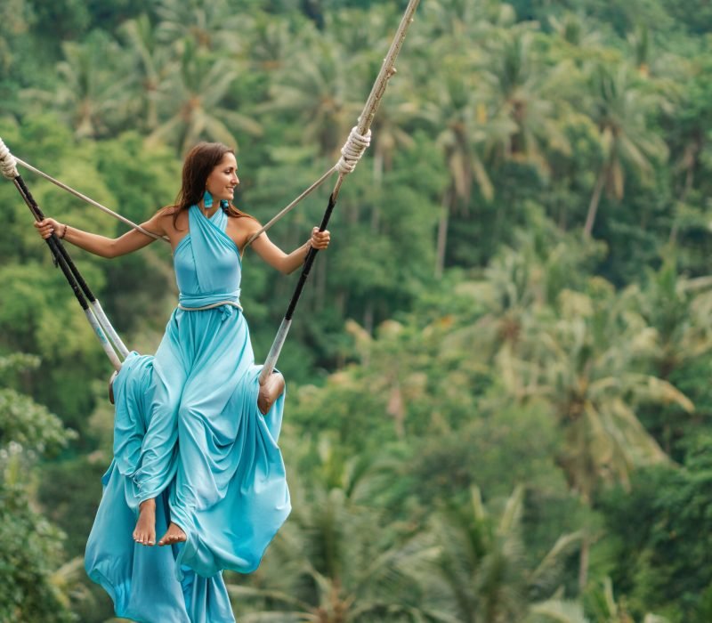 Tanned,Beautiful,Woman,In,A,Long,Turquoise,Dress,With,A