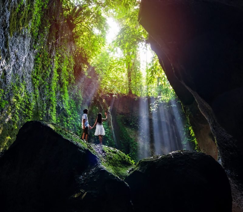 Young,Couple,Tourism,With,Rays,Of,Light,Enjoying,Tukad,Cepung